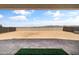 View of the spacious backyard with block fence, ready for landscaping and outdoor living at 30382 W Vale Dr, Buckeye, AZ 85396
