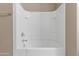 A simple bathtub area with tile surround at 30382 W Vale Dr, Buckeye, AZ 85396