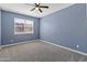 Comfortable bedroom featuring carpet and natural light at 30382 W Vale Dr, Buckeye, AZ 85396