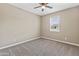 Cozy bedroom offers a serene retreat with ample natural light and a ceiling fan at 30382 W Vale Dr, Buckeye, AZ 85396