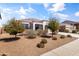 Charming single-story home with a well-maintained front yard, and terracotta colored roof tiles at 30382 W Vale Dr, Buckeye, AZ 85396
