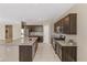 Spacious kitchen features granite countertops, stainless steel appliances, and ample storage space at 30382 W Vale Dr, Buckeye, AZ 85396
