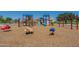 playground with various climbing and ride-on toys at 30382 W Vale Dr, Buckeye, AZ 85396