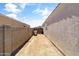 Wide side yard with block fencing, providing privacy and potential for storage at 30382 W Vale Dr, Buckeye, AZ 85396
