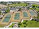 Aerial view of four tennis courts and surrounding parkland at 30382 W Vale Dr, Buckeye, AZ 85396