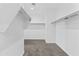 Large walk-in closet with carpet flooring and hanging storage rods at 30382 W Vale Dr, Buckeye, AZ 85396