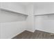 Spacious walk-in closet provides ample storage with built in hanging rods at 30382 W Vale Dr, Buckeye, AZ 85396