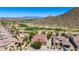 Stunning aerial view of a neighborhood home next to a golf course, highlighting its prime location at 31525 N Gold Field Rd, San Tan Valley, AZ 85143