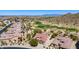 The property features desert landscaping with mountain views, and community golf course at 31525 N Gold Field Rd, San Tan Valley, AZ 85143