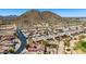 The aerial view showcases a community with stunning mountain views and a nearby golf course at 31525 N Gold Field Rd, San Tan Valley, AZ 85143