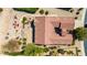 An aerial view of the property shows a unique design with an outdoor fire pit and lush desert landscaping at 31525 N Gold Field Rd, San Tan Valley, AZ 85143