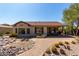 Paver patio shows desert landscaping and covered area with outdoor dining set at 31525 N Gold Field Rd, San Tan Valley, AZ 85143