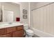Bathroom with a single sink vanity, tub and shower combo, and ample wall decor at 31525 N Gold Field Rd, San Tan Valley, AZ 85143