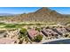 Charming exterior with desert landscaping, golf course views, and mountain backdrop at 31525 N Gold Field Rd, San Tan Valley, AZ 85143