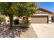 Charming single-story home with a well-manicured front yard and a two-car garage at 31525 N Gold Field Rd, San Tan Valley, AZ 85143