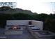 Cozy backyard fire pit area with cushioned seating, perfect for outdoor relaxation and entertaining in the evening at 31525 N Gold Field Rd, San Tan Valley, AZ 85143