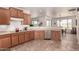 Spacious kitchen with a breakfast bar, stainless steel appliances, and views of the dining area at 31525 N Gold Field Rd, San Tan Valley, AZ 85143