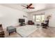 Spacious living room with tile floors, a ceiling fan, and a bright window with desert views at 31525 N Gold Field Rd, San Tan Valley, AZ 85143
