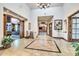 Spacious lobby featuring tile flooring, detailed woodwork, and views into the library at 31525 N Gold Field Rd, San Tan Valley, AZ 85143