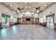 Open meeting room with hardwood-style floors and built-in cabinets at 31525 N Gold Field Rd, San Tan Valley, AZ 85143