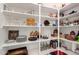 Spacious pantry with shelving providing ample storage for dishes, cookware, and canned goods at 31525 N Gold Field Rd, San Tan Valley, AZ 85143