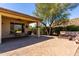 Spacious paver patio with mountain views, desert landscaping, and built-in seating area with fire pit at 31525 N Gold Field Rd, San Tan Valley, AZ 85143