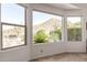 Bright windows with scenic desert views from the bedroom with a rock patio area at 31525 N Gold Field Rd, San Tan Valley, AZ 85143