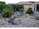 Backyard water feature cascading over natural rocks, enhancing the serene and tranquil ambiance of the outdoor space at 31525 N Gold Field Rd, San Tan Valley, AZ 85143