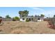 Large backyard with low maintenance ground cover and covered patio at 3517 E Hartford Ave, Phoenix, AZ 85032