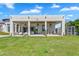 Expansive backyard with covered patio, outdoor seating and a chicken coop at 4037 E Minton Cir, Mesa, AZ 85215