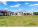 A sprawling backyard with well manicured lawn, outdoor seating and covered patios at 4037 E Minton Cir, Mesa, AZ 85215