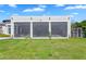 Backyard features a covered patio with full sunshades, outdoor seating and a chicken coop at 4037 E Minton Cir, Mesa, AZ 85215