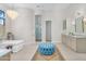 Serene bathroom with soaking tub, walk-in shower, and stylish vanity area at 4037 E Minton Cir, Mesa, AZ 85215