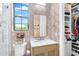 Elegant powder room featuring classic fixtures, patterned wallpaper, and bright natural light at 4037 E Minton Cir, Mesa, AZ 85215