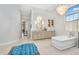 Elegant bathroom featuring a soaking tub, marble countertop, and chandelier lighting at 4037 E Minton Cir, Mesa, AZ 85215