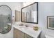 Well-lit bathroom featuring neutral tones, a large mirror, and modern fixtures at 4037 E Minton Cir, Mesa, AZ 85215