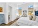 Bright bedroom boasts modern decor, natural light, and wood floors at 4037 E Minton Cir, Mesa, AZ 85215