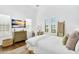Bright bedroom featuring a desk, window shutters and television at 4037 E Minton Cir, Mesa, AZ 85215