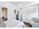 Well-lit bedroom with a blue dresser, neutral decor, and closet with sliding doors at 4037 E Minton Cir, Mesa, AZ 85215