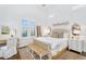Serene bedroom featuring a comfortable bed, neutral tones, and natural light at 4037 E Minton Cir, Mesa, AZ 85215