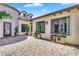 Private courtyard featuring paver flooring, exterior lighting, and lush plants and greenery at 4037 E Minton Cir, Mesa, AZ 85215