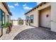 Private side courtyard featuring paver flooring, exterior lighting, and a lovely fountain at 4037 E Minton Cir, Mesa, AZ 85215