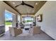 Relaxing covered patio with comfortable seating and view to pool and spa area at 4037 E Minton Cir, Mesa, AZ 85215