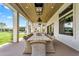 Inviting outdoor patio featuring a rustic dining table and an open view of the backyard at 4037 E Minton Cir, Mesa, AZ 85215