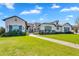 Beautiful single Gathering home featuring a manicured lawn, paver walkway, and a private gated entrance at 4037 E Minton Cir, Mesa, AZ 85215
