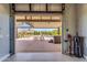 View from garage to pool and spa area with patio seating and hot tub at 4037 E Minton Cir, Mesa, AZ 85215