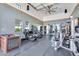 Bright and spacious home gym with a variety of exercise equipment and ample natural light at 4037 E Minton Cir, Mesa, AZ 85215
