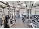 Well-equipped home gym featuring a variety of fitness equipment and a mirrored wall at 4037 E Minton Cir, Mesa, AZ 85215