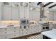 Elegant kitchen with custom cabinets, stainless steel appliances, and sleek countertops at 4037 E Minton Cir, Mesa, AZ 85215