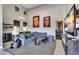 Inviting living room with modern decor, a wet bar, and access to a home gym at 4037 E Minton Cir, Mesa, AZ 85215